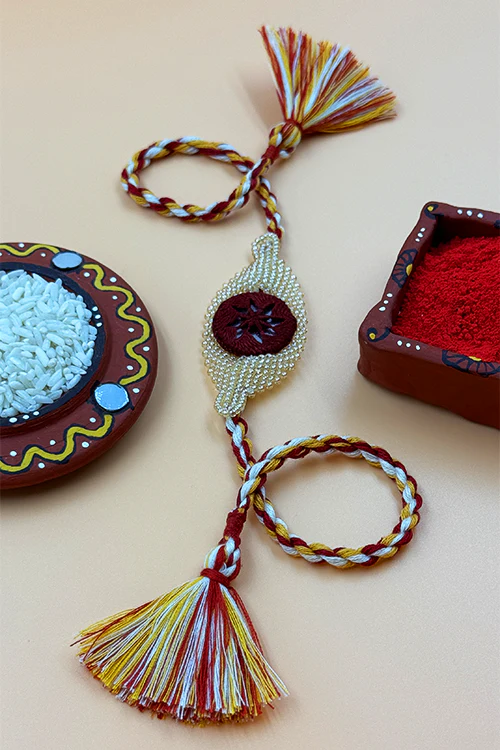 Antarang  (Set Of 2) Beaded Elegance Rakhi, 100% Cotton, Bhai Rakhi. Marron-Golden. Made By Divyang Rural Women - Image 2