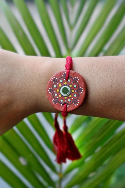 Antarang (Set Of 2) Terracotta. Antarang-Terracotta. Dharti- Handpainted Terracotta Rakhi Made By Divyang Rural Women