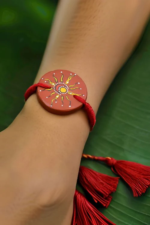 Antarang (Set Of 2) Terracotta. Antarang-Terracotta. Suraj- Chanda- Handpainted Terracota Rakhi. Made By Divyang Rural Women