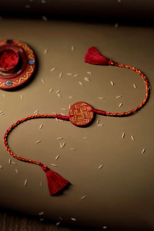 Antarang (Set Of 2) Terracotta. Swastik- Handpainted Terracotta Rakhi. Made By Divyang Rural Women - Image 2
