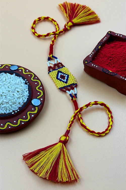 Antarang (Set Of 2) Traditional Saurastra Beadwork Rakhi, 100% Cotton, Bhai Rakhi. Yellow-Marron. Made By Divyang Rural Women - Image 2