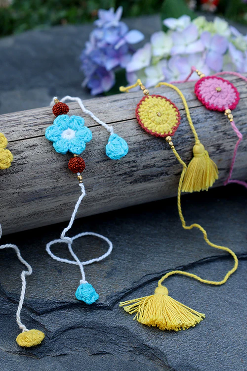 Himalayan Blooms 2 Genda Rakhi+ 2 Kali Rakhi (Set Of - 4) - Image 2