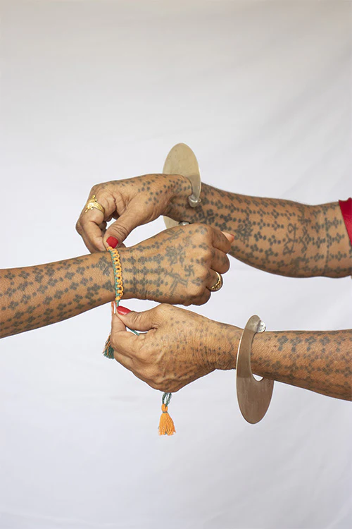 Okhai 'Sarayu' Orange Organic Cotton Thread Rakhi - Image 2
