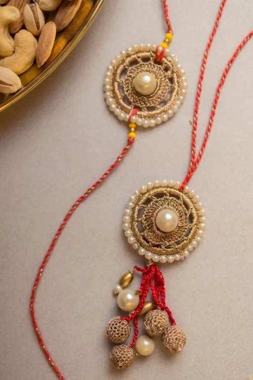 Samoolam Antique Pearl Crochet Rakhi & Lumba Set (Set Of 2) - Image 2