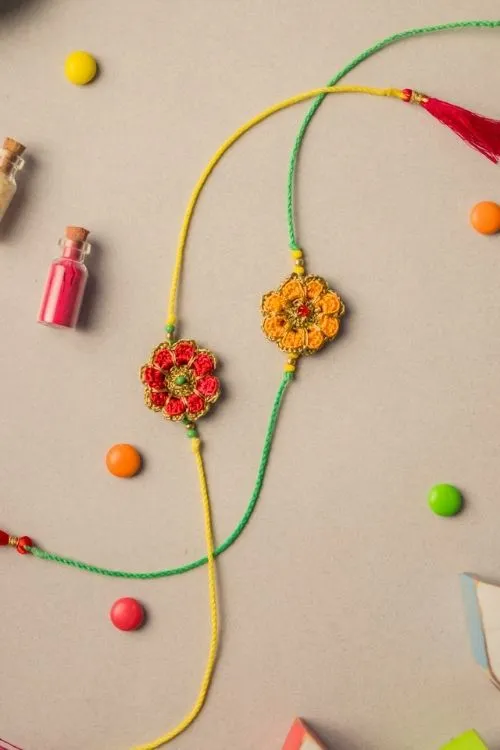 Samoolam Festive Marigold Crochet Rakhi Set (Set Of 2) - Image 3