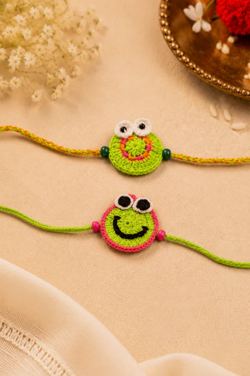 WHE Handmade Crochet Smiley Face Rakhi - Image 2